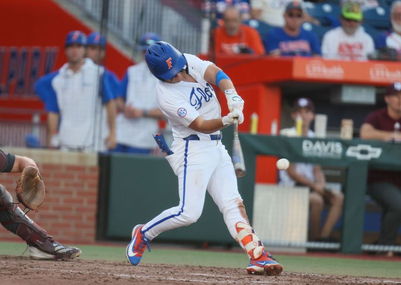 Florida infielder Cade Kurland (4) hits during an NCAA baseball game at Condron Family Ballpark at Alfred A. McKethan Field in Gainesville, FL on Friday, April 24, 2026. [Alan Youngblood/Gainesville Sun]