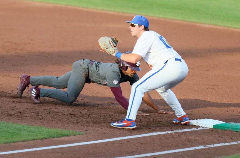 Florida infielder Ethan Surowiec (10) goes for the tag on Texas A&M outfielder Terrence Kiel II (1) at first during an NCAA baseball game at Condron Family Ballpark at Alfred A. McKethan Field in Gainesville, FL on Friday, April 24, 2026. [Alan Youngblood/Gainesville Sun]