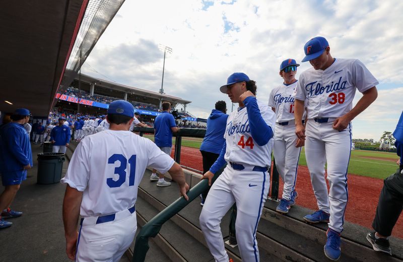Florida players head to the dug out as the game against Texas A&M begins during an NCAA baseball game at Condron Family Ballpark at Alfred A. McKethan Field in Gainesville, FL on Friday, April 24, 2026. [Alan Youngblood/Gainesville Sun]