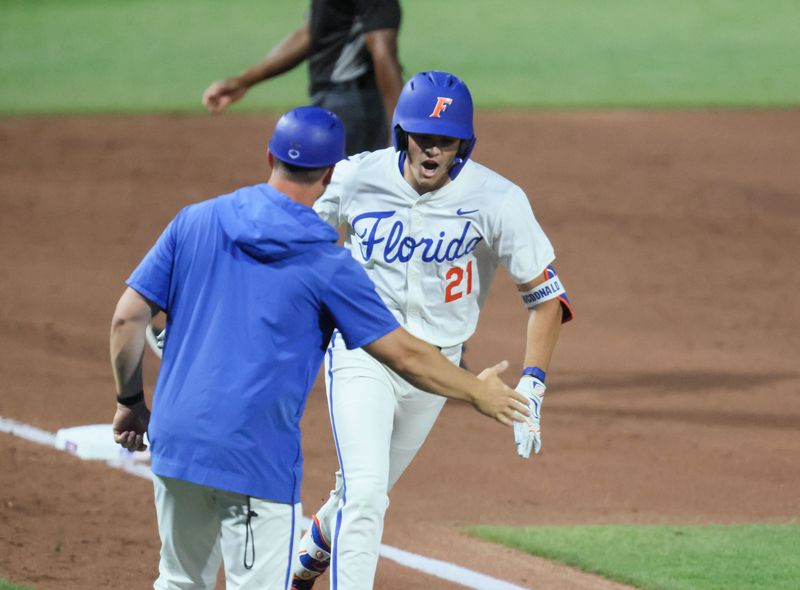 Florida utility Caden McDonald (21) celebrates his home run against Texas A&M during an NCAA baseball game at Condron Family Ballpark at Alfred A. McKethan Field in Gainesville, FL on Friday, April 24, 2026. [Alan Youngblood/Gainesville Sun]