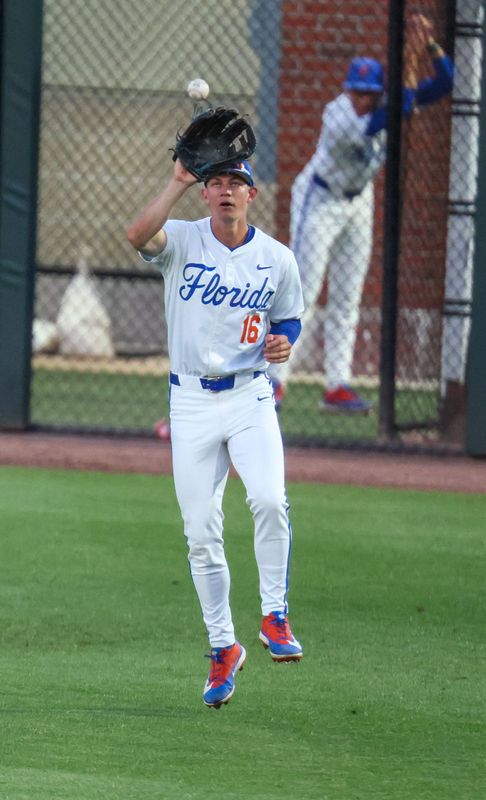 Florida outfielder Hayden Yost (16) grabs a long fly during an NCAA baseball game at Condron Family Ballpark at Alfred A. McKethan Field in Gainesville, FL on Friday, April 24, 2026. [Alan Youngblood/Gainesville Sun]