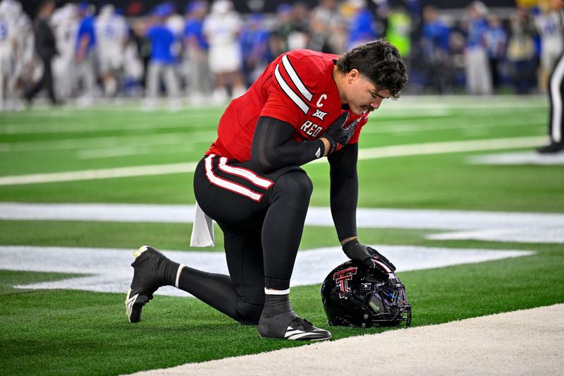 Dec 6, 2025; Arlington, TX, USA; Texas Tech Red Raiders linebacker Jacob Rodriguez (10) kneels on the field before the game between the Red Raiders and the Cougars at AT&T Stadium. Mandatory Credit: Jerome Miron-Imagn Images