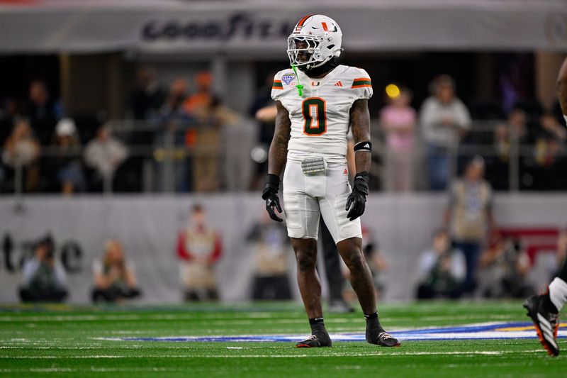 Dec 31, 2025; Arlington, TX, USA; Miami Hurricanes defensive back Keionte Scott (0) looks on during the 2025 Cotton Bowl and quarterfinal game of the College Football Playoff at AT&T Stadium. Mandatory Credit: Jerome Miron-Imagn Images