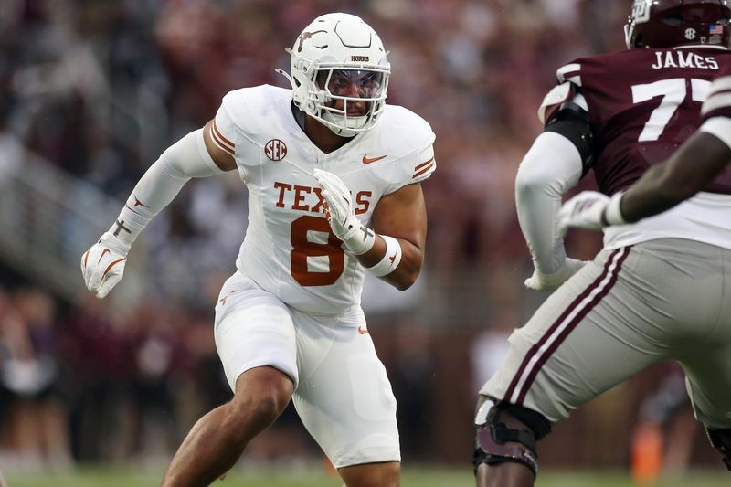 Oct 25, 2025; Starkville, Mississippi, USA; Texas Longhorns linebacker Trey Moore (8) attempts to get into the backfield during the second quarter against the Mississippi State Bulldogs at Davis Wade Stadium at Scott Field. Mandatory Credit: Petre Thomas-Imagn Images