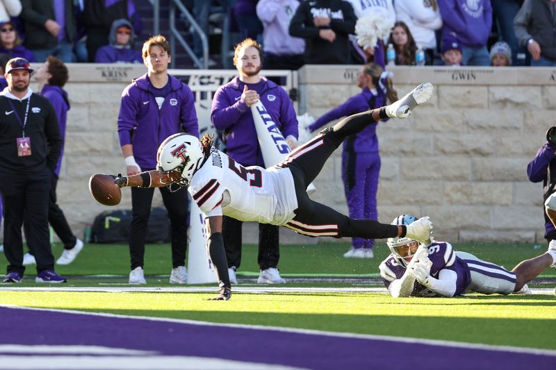 Nov 1, 2025; Manhattan, Kansas, USA; Texas Tech Red Raiders wide receiver Caleb Douglas (5) is tackled with the ball short of the goal line by Kansas State Wildcats cornerback Donovan McIntosh (9) during the third quarter at Bill Snyder Family Football Stadium. Mandatory Credit: Scott Sewell-Imagn Images