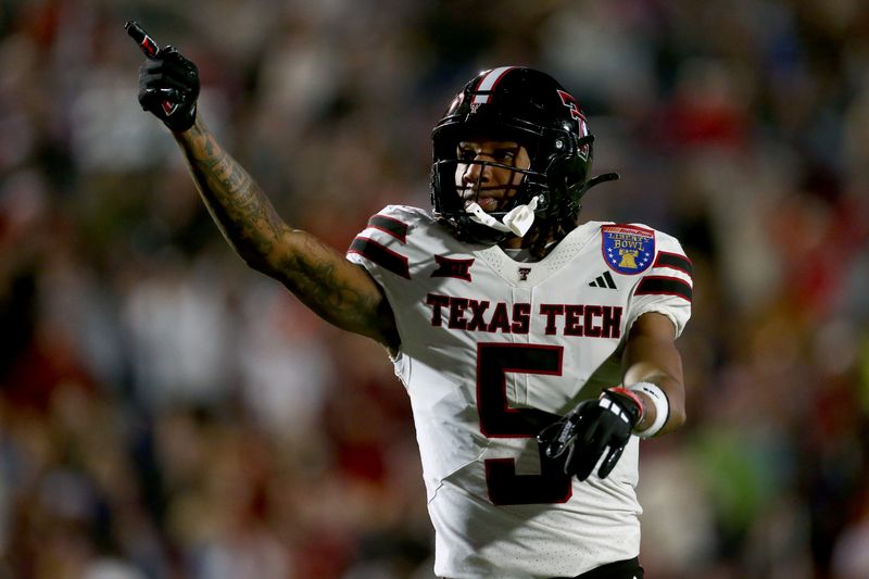 Dec 27, 2024; Memphis, TN, USA; Texas Tech Red Raiders wide receiver Caleb Douglas (5) reacts after a first down catch during the second quarter against the Arkansas Razorbacks at Simmons Bank Liberty Stadium. Mandatory Credit: Petre Thomas-Imagn Images