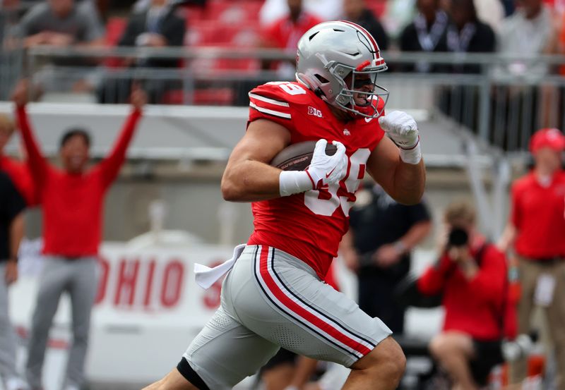 Sep 6, 2025; Columbus, Ohio, USA; Ohio State Buckeyes tight end Will Kacmarek (89) catches a pass for a touchdown during the first quarter against the Grambling State Tigers at Ohio Stadium. Mandatory Credit: Joseph Maiorana-Imagn Images