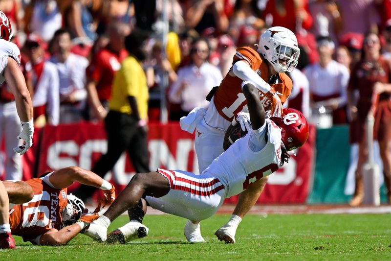Oct 11, 2025; Dallas, Texas, USA; Oklahoma Sooners running back Tory Blaylock (6) is tackled by Texas Longhorns defensive back Michael Taaffe (16) during the first half at the Cotton Bowl. Mandatory Credit: Jerome Miron-Imagn Images