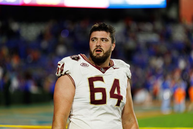 Nov 29, 2025; Gainesville, Florida, USA; Florida State Seminoles offensive lineman Jacob Rizy (64) looks on after a game against the Florida Gators at Ben Hill Griffin Stadium. Mandatory Credit: Matt Pendleton-Imagn Images