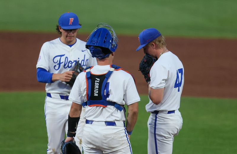 Florida has a mound conference during an NCAA baseball game at Condron Family Ballpark at Alfred A. McKethan Field in Gainesville, FL on Friday, April 24, 2026. [Alan Youngblood/Gainesville Sun]