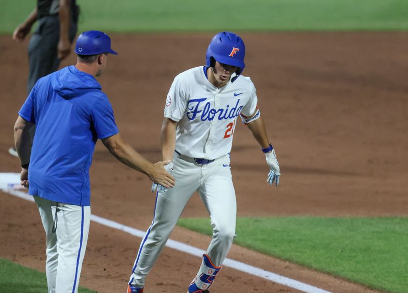 Florida utility Caden McDonald (21) celebrates his home run against Texas A&M during an NCAA baseball game at Condron Family Ballpark at Alfred A. McKethan Field in Gainesville, FL on Friday, April 24, 2026. [Alan Youngblood/Gainesville Sun]