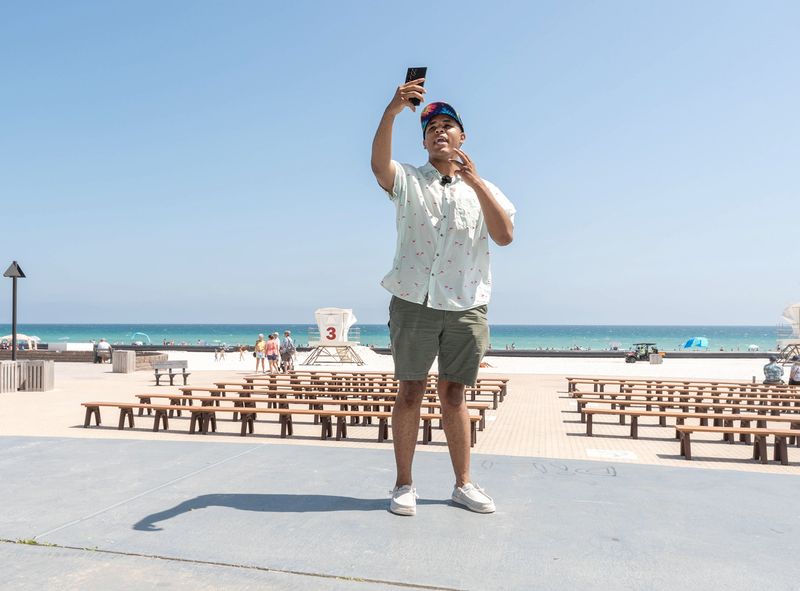TicTok creator Tayflawda records a video at Pensacola Beach on April 27, 2026.
