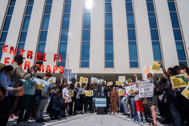 Activists gather outside the North Portico at the Florida Capitol to protest the proposed redistricting map Tuesday, April 28, 2026.