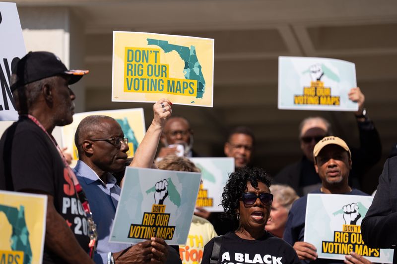 Protesters gather near the Florida Capitol on April 28, 2026, to protest the Florida Legislature's plan to dramatically redraw the state's congressional districts. On April 29, the Legislature voted to approve a new congressional redistricting map.