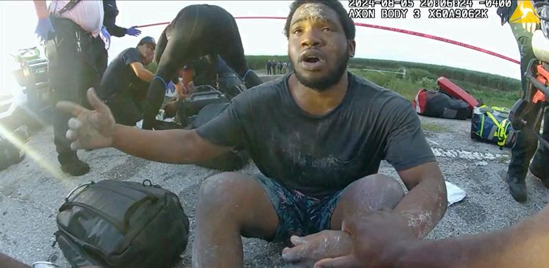 Jorden Hall appears at the scene of a wreck in Belle Glade that killed nine of his relatives Aug. 5, 2024. He was the only survivor among 10 people in a rented vehicle that plunged into a Glades canal.