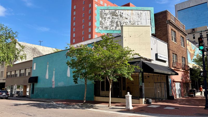Three buildings at the corner of Laura Street and Monroe Street in downtown Jacksonville are shown looking toward them from the direction of James Weldon Johnson Park. All the buildings are vacant. A developer plans to restore them with space for stores and restaurants plus one-bedroom apartments.