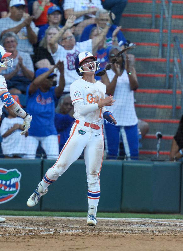 Florida infielder Gabi Comia (10) celebrates stealing home during a NCAA softball game at Katie Seashole Pressly Stadium in Gainesville, FL on Tuesday, April 28, 2026. [Alan Youngblood/Gainesville Sun]