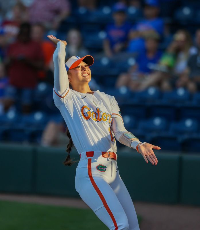 Florida infielder Gabi Comia (10) joins the team before a NCAA softball game at Katie Seashole Pressly Stadium in Gainesville, FL on Tuesday, April 28, 2026. [Alan Youngblood/Gainesville Sun]