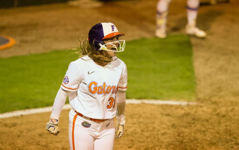 Florida infielder Kenleigh Cahalan (31) celebrates a run during a NCAA softball game at Katie Seashole Pressly Stadium in Gainesville, FL on Tuesday, April 28, 2026. [Alan Youngblood/Gainesville Sun]