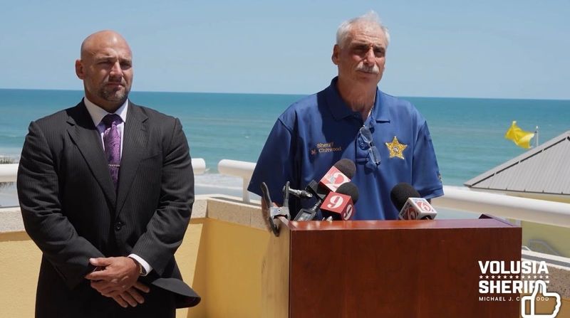 Attorney Aaron Delgado (left) next to Volusia Sheriff Mike Chitwood during a press conference April 24 about the sheriff's office suing two women accused of organizing an unpermitted spring break event in Daytona Beach.