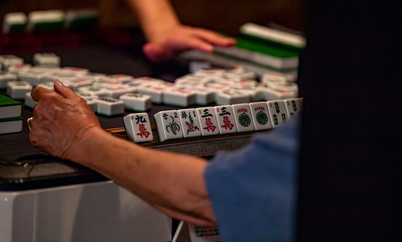 Mahjong tiles line a rack during a game at The Velvet Wind on April 30, 2026, in downtown Asheville.