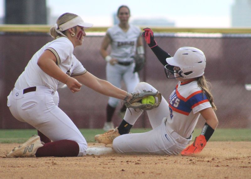 Episcopal shortstop Summer Stearns applies the tag to Bolles runner Aleda Cashwell during the FHSAA District 4-2A girls softball final in Jacksonville, Florida on April 30, 2026. [Clayton Freeman/Florida Times-Union]
