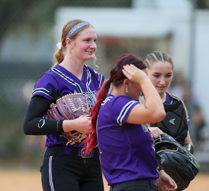 Gainesville Leanna Bourdage (14), left, celebrates her 500th strike out during 5A district 5 championship at Gainesville High School in Gainesville, FL on Thursday, April 30, 2026. [Alan Youngblood/Gainesville Sun]