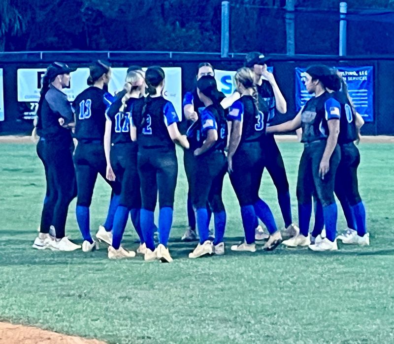 The Sebastian River High softball team meets in right field after losing the Class 5A-District 13 championship to Bayside High, 4-2, on Thursday evening in Sebastian.