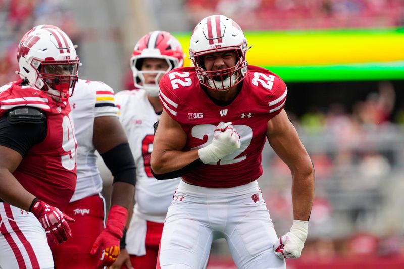 Sep 20, 2025; Madison, Wisconsin, USA; Wisconsin Badgers linebacker Mason Reiger (22) reacts following a tackle during the third quarter against the Maryland Terrapins at Camp Randall Stadium. Mandatory Credit: Jeff Hanisch-Imagn Images