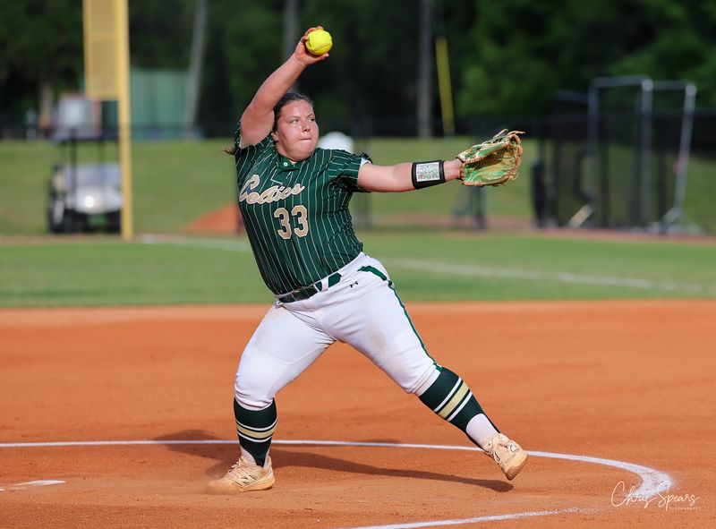Trinity's Caylee Barbe (33) delivers a pitch in the third inning. On Thursday, Apr 30, 2026, the Trinity Catholic Varsity Girls Softball team won their game against Umatilla High School by a score of 3-0. This match was to crown the 2A District 6 champions. (photo - Chris Spears Photography) #TBGTG