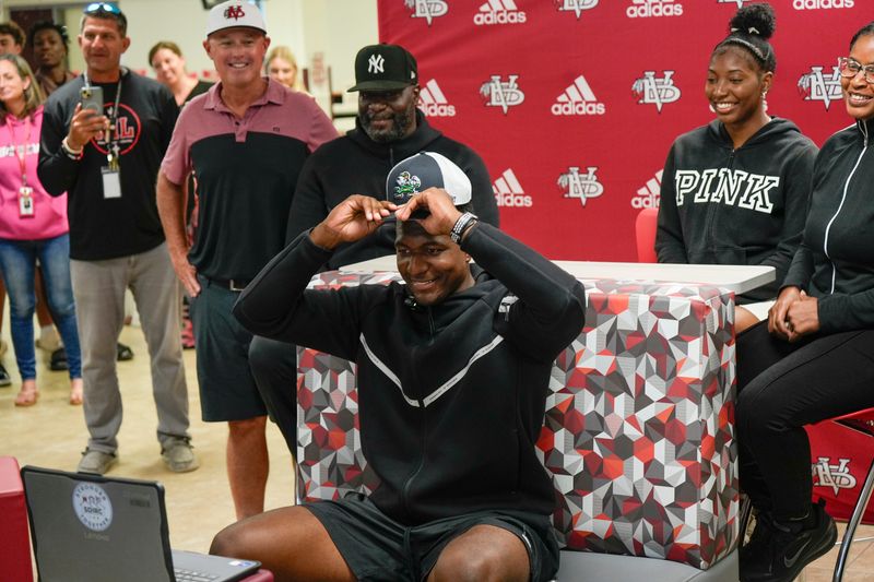 Vero Beach quarterback Wonderful “Champ” Monds IV, a four-star recruit, announces his college decision to attend University of Notre Dame live on the Pat McAfee Show on ESPN, May 1, 2026, at Vero Beach High School along surrounded by family members, teammates and coach Lenny Jankowski. Monds is rated the No. 2 quarterback in Florida and the No. 22 overall recruit in the state on the USA TODAY Florida Network Top 100.