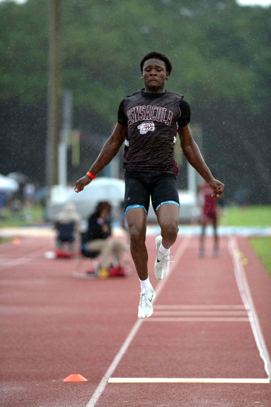 High school athletes compete in a variety of field events, such as the long jump, shot put, high jump, discus, and pole vault, during the Region 1-1A and Region 1-2A Track and Field Championship at Pine Forest on May 1, 2026.