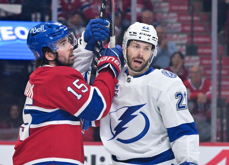 May 1, 2026; Montreal, Quebec, CAN; Montreal Canadiens forward Alex Newhook (15) and Tampa Bay Lightning forward Oliver Bjorkstrand (22) during the second period in game six of the first round of the 2026 Stanley Cup Playoffs at the Bell Centre.
