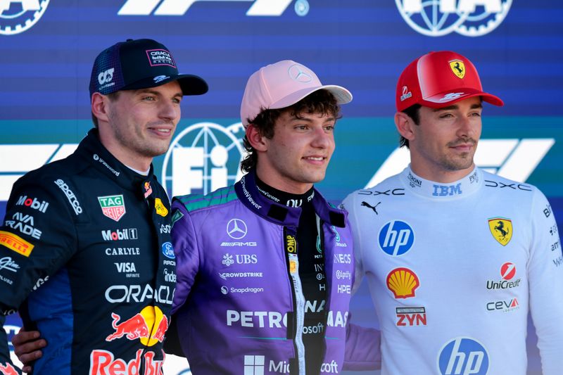 Red Bull Racing driver Max Verstappen (left), Mercedes driver Andrea Kimi Antonelli (center) and Ferrari driver Charles Leclerc (16) pose for a photo after finishing the qualifying session for the F1 Miami Grand Prix at Miami International Autodrome.
