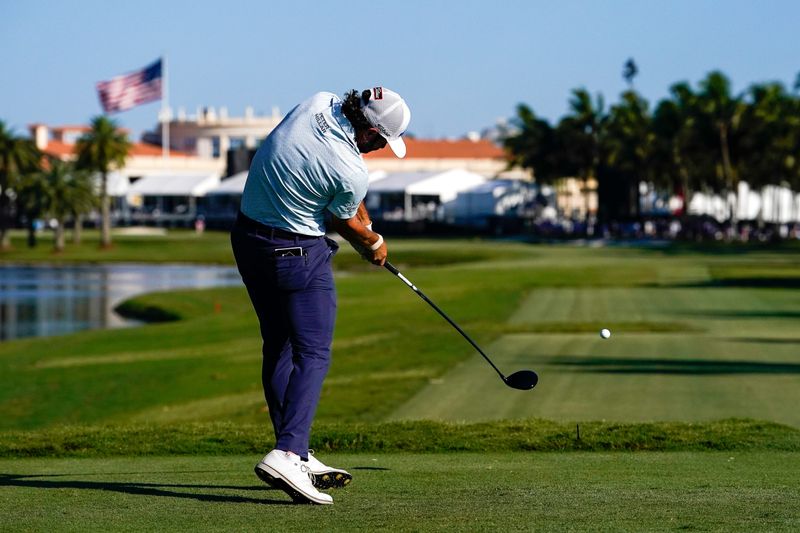 May 2, 2026; Miami, Florida, USA; Cameron Young plays his tee shot on the 18th hole during the third round of the Cadillac Championship golf tournament. Mandatory Credit: Jeff Romance-Imagn Images