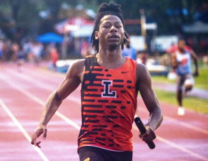 Lakeland senior DJ Dobie win the 4x100 on Saturday at the Class 4A, Region 2 track and field meet at George Jenkins High School.