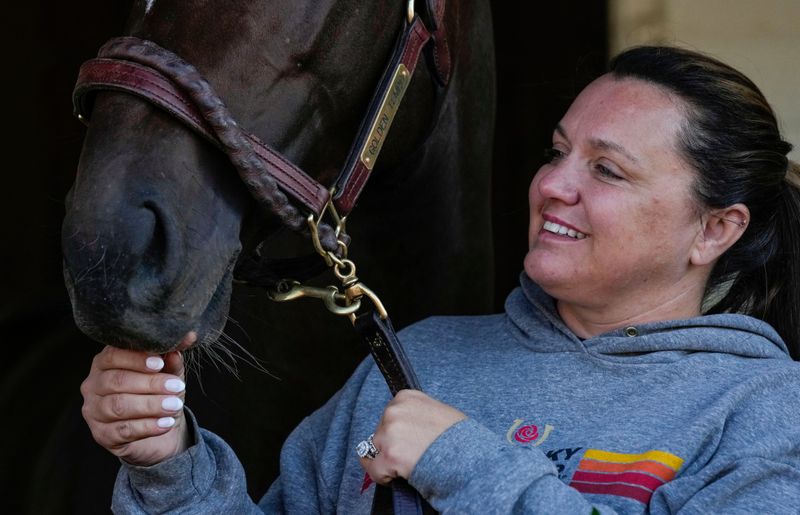Cherie DeVaux pets Golden Tempo the day after winning the 152nd running of the Kentucky Derby at Churchill Downs on Sunday, May 3, 2026.