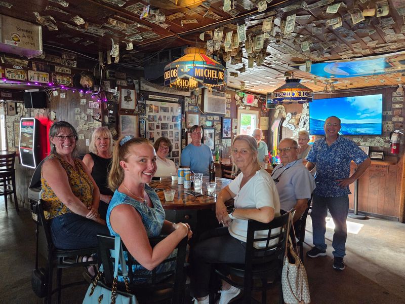 Keith Murray (far right) with his neighbors inside Ralph's Stand Up Bar.