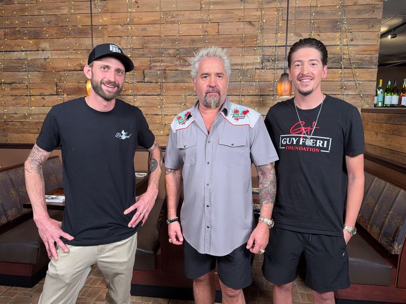 Driftwood's chef-owner Jimmy Everett with Guy Fieri and Hunter Fieri. The episode's first airing is May 8.