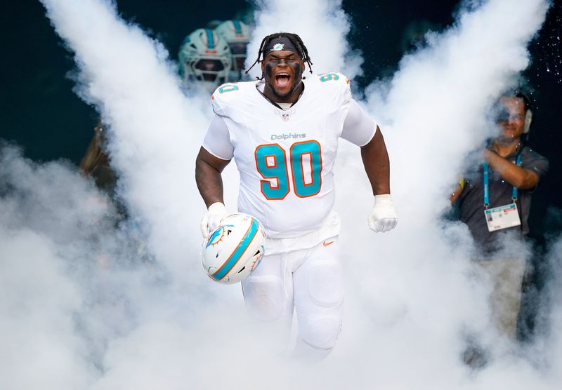 Nov 9, 2025; Miami Gardens, Florida, USA; Miami Dolphins defensive tackle Kenneth Grant (90) runs on the field before a game against the Buffalo Bills at Hard Rock Stadium. Mandatory Credit: Jeff Romance-Imagn Images