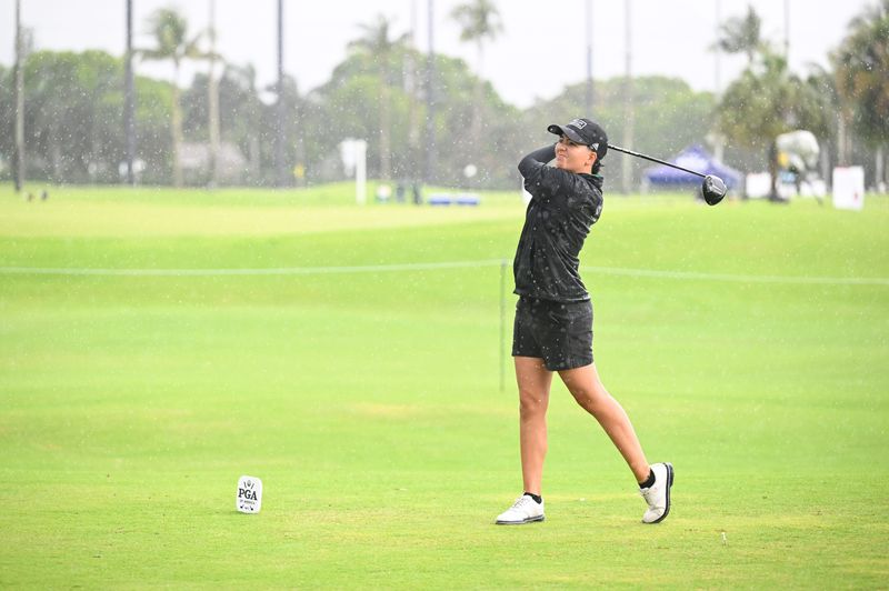 Lucia Ramirez of Texas A&M University - Corpus Christi hits her tee shot in the rain during the first round of the PGA WORKS Collegiate Championship at The Park on May 4.