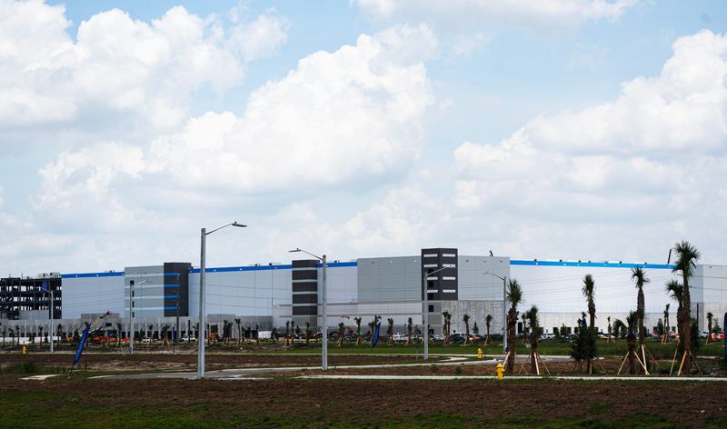 Walls are going up on the massive Amazon fulfillment center on State Road 82 in Fort Myers. Photographed on Tuesday, May 5, 2026.