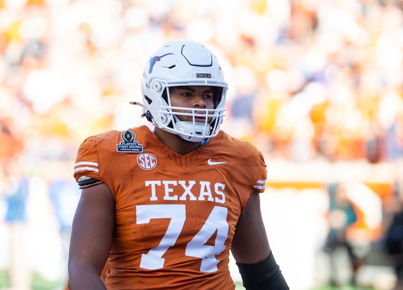 Dec 21, 2024; Austin, Texas, USA; Texas Longhorns offensive lineman Trevor Goosby (74) against the Clemson Tigers during the CFP National playoff first round at Darrell K Royal-Texas Memorial Stadium. Mandatory Credit: Mark J. Rebilas-Imagn Images