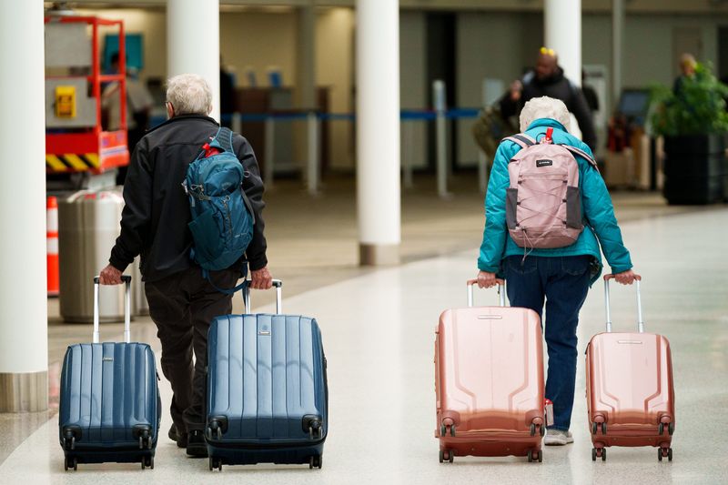 Travelers walk through South Bend International Airport on Wednesday, May 6, 2026, in South Bend.