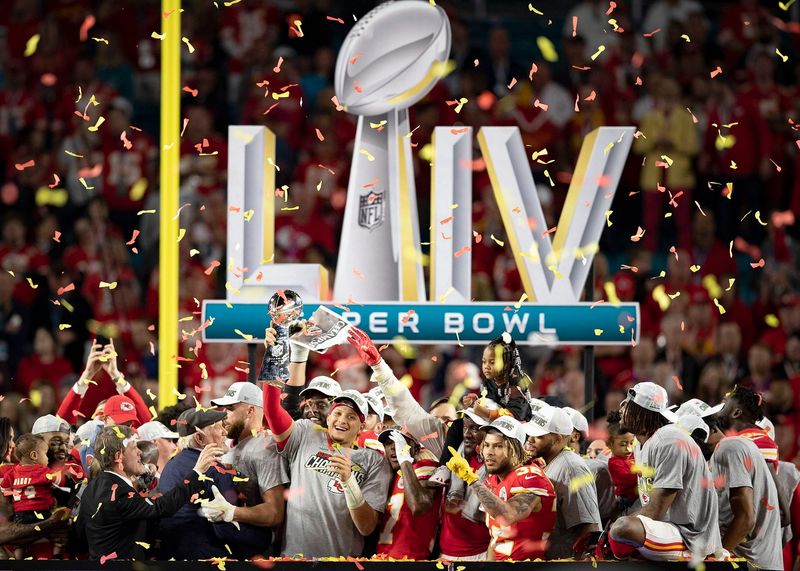 Kansas City Chiefs quarterback Patrick Mahomes (15) celebrates with the Vince Lombardi Trophy after Super Bowl LIV win over the 49ers at Hard Rock Stadium in Miami Gardens, Feb. 2, 2020. [ALLEN EYESTONE/The Palm Beach Post]