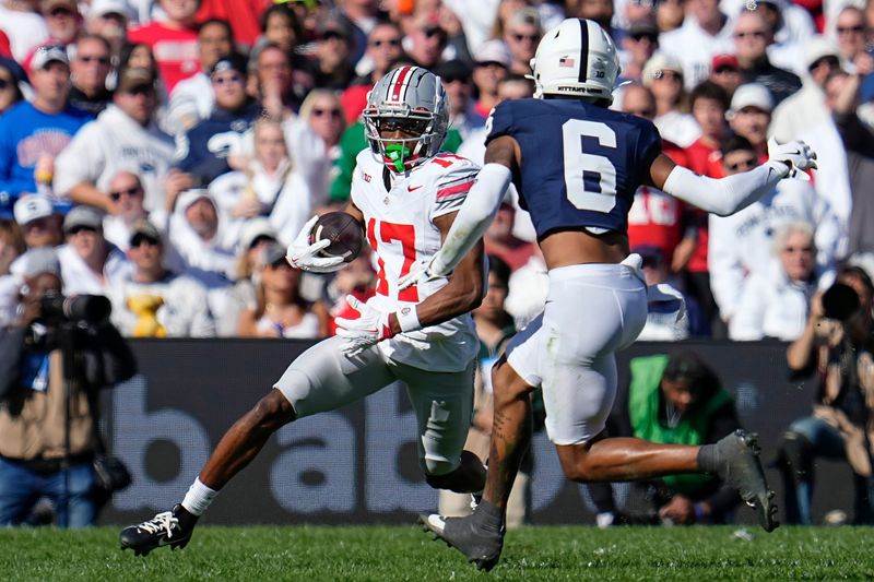 Ohio State Buckeyes wide receiver Carnell Tate (17) runs toward Penn State Nittany Lions safety Zakee Wheatley (6) during the NCAA football game at Beaver Stadium in University Park, Pa. on Monday, Nov. 4, 2024. Ohio State won 20-13.