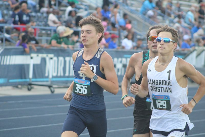 Melbourne Holy Trinity's Evan Spreitzer (356) leads Cambridge Christian's Mark Meister (129) and Providence's Sam Loftin in the boys 1,600 during the FHSAA Class 1A high school track and field championships in Jacksonville, Florida, on May 6, 2026. [Clayton Freeman/Florida Times-Union]