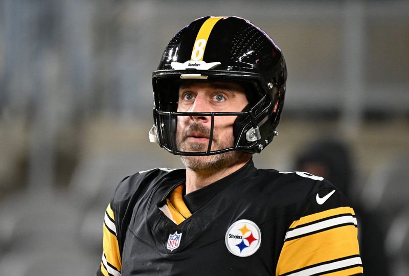Jan 12, 2026; Pittsburgh, PA, USA; Pittsburgh Steelers quarterback Aaron Rodgers (8) warms up before an AFC Wild Card Round game against the Houston Texans at Acrisure Stadium.