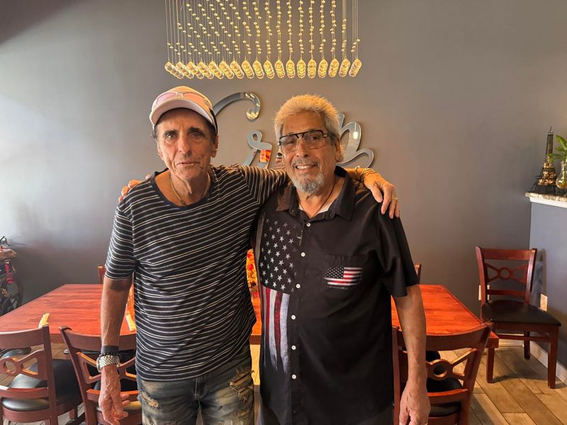 Rocker Alice Cooper poses with Crisp Creperie owner Jack Hernandez on May 6 while on a tour stop for his show the previous night at Barbara B. Mann Performing Arts Hall. He and his wife had crepes for lunch at the Cape Coral restaurant.