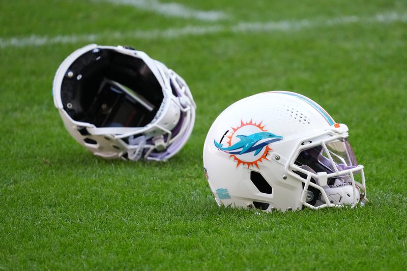 Nov 12, 2025; Madrid, Spain; Miami Dolphins helmets on the field during practice at Estadio Riyadh Air Metropolitano. Mandatory Credit: Kirby Lee-Imagn Images
